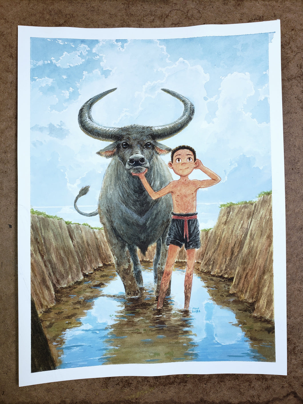 Hmong boy with water buffalo